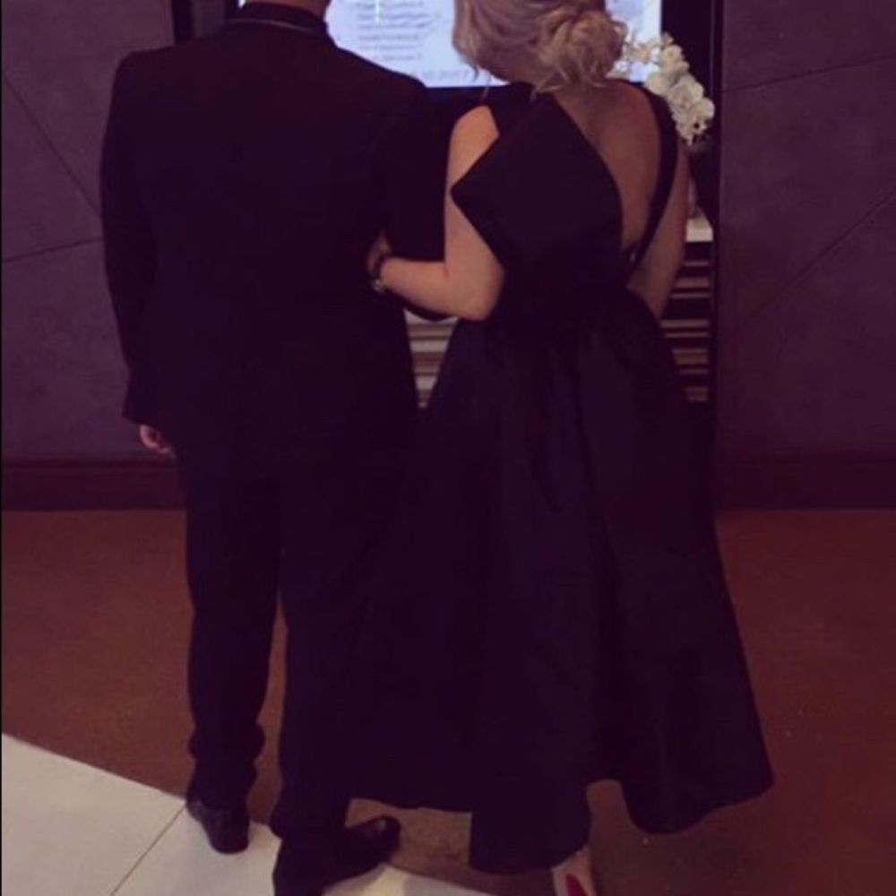 Black evening gown with huge bow on the back